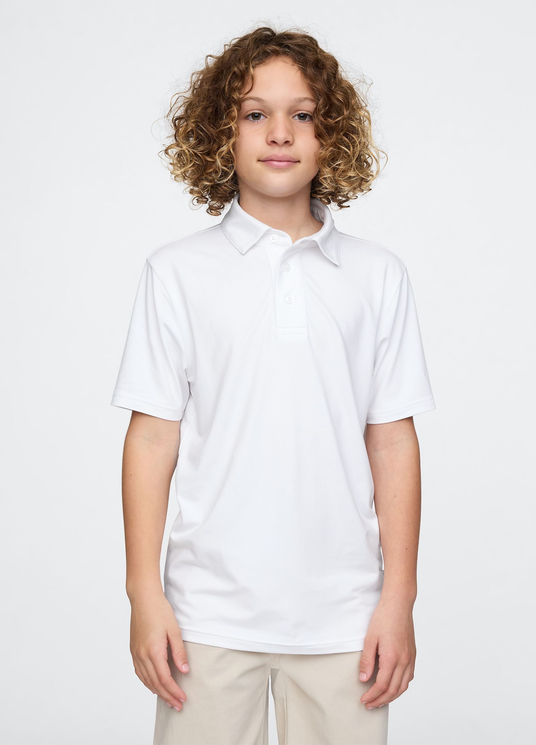 Polo bianca a maniche corte in tessuto elasticizzato GAP Kids