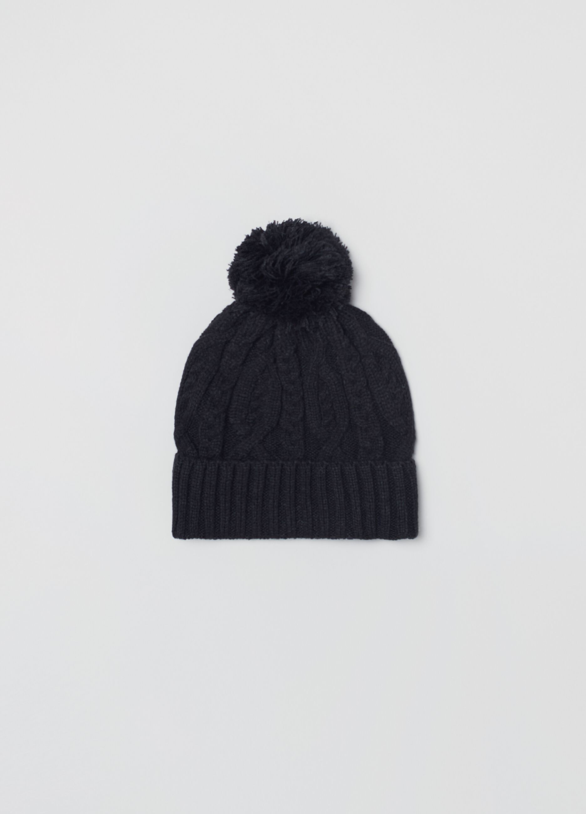 Cable knit cap with pom-pom