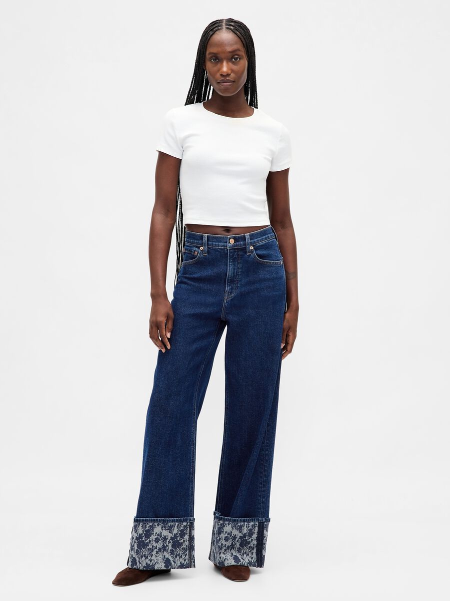 Wide denim trousers with floral turn-up Woman_0