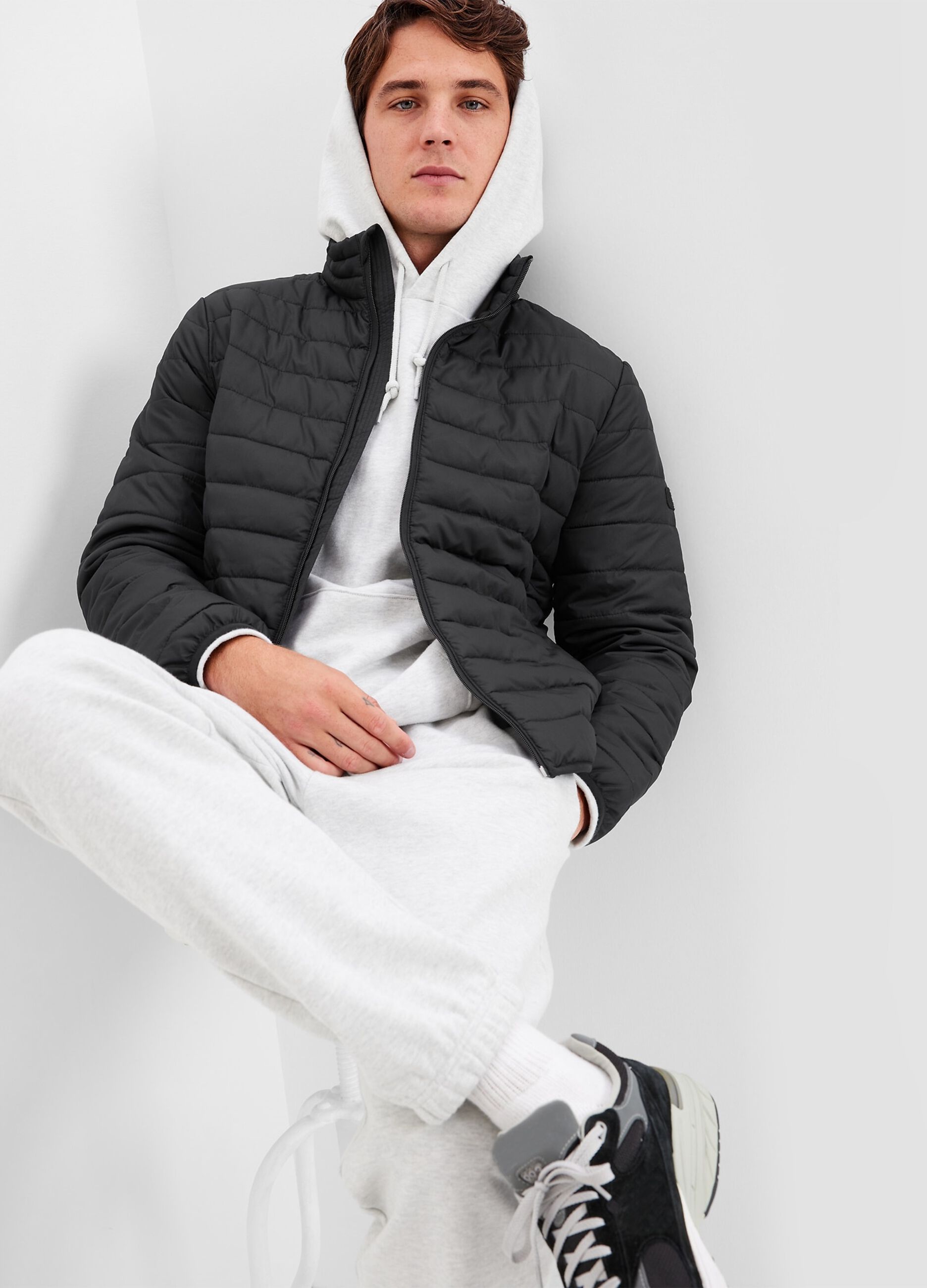 Full-zip puffer jacket with high neck and logo patch