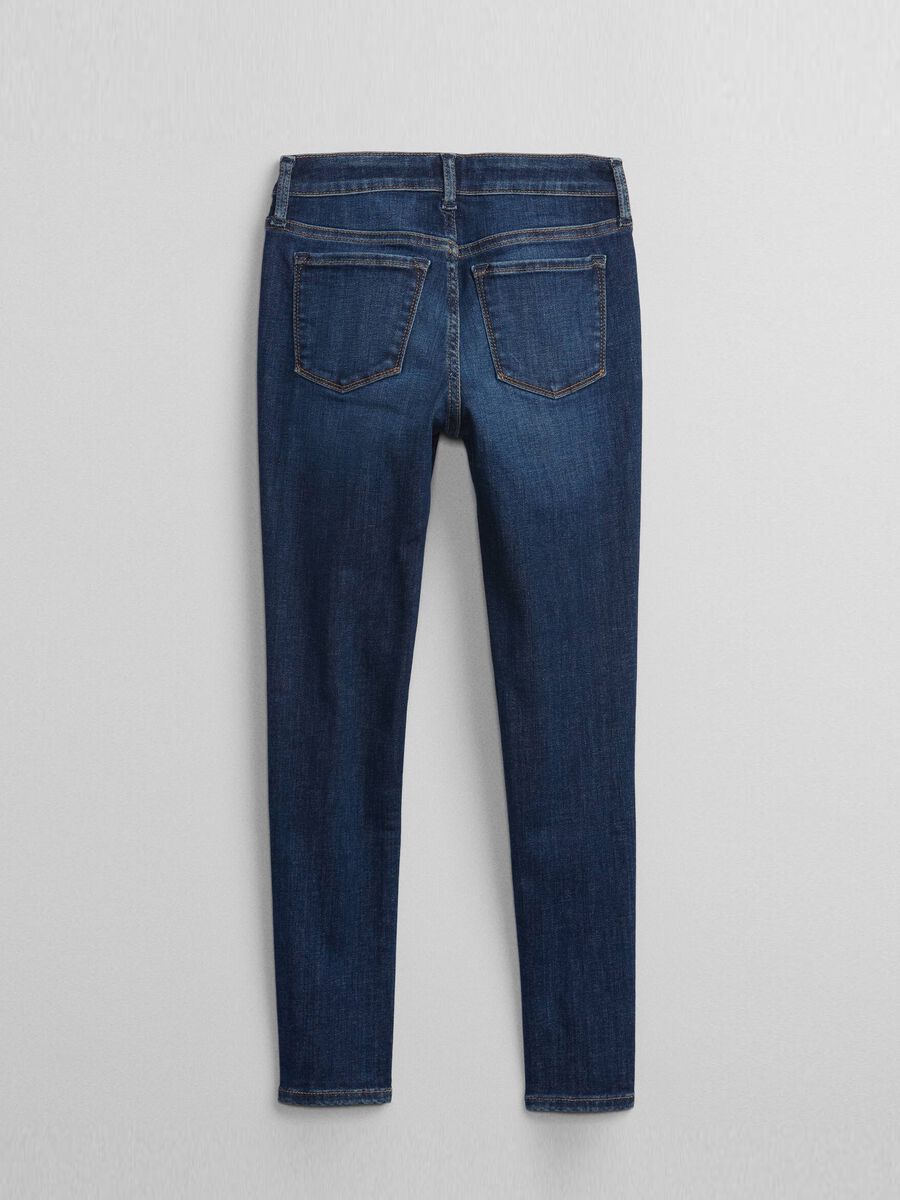 Jeans slim fit con bottoni automatici Bambina_1