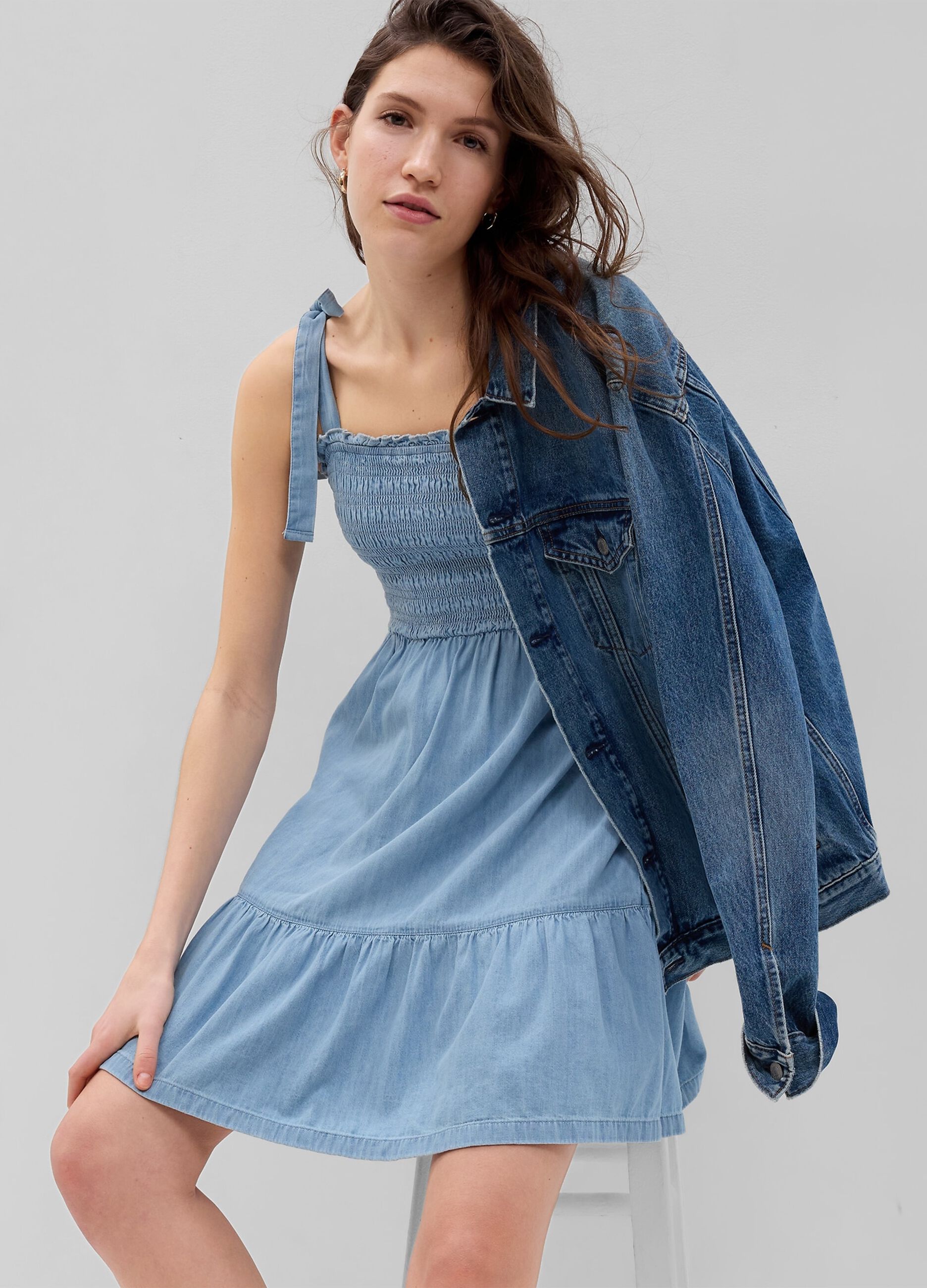 Short denim dress with smock stitch