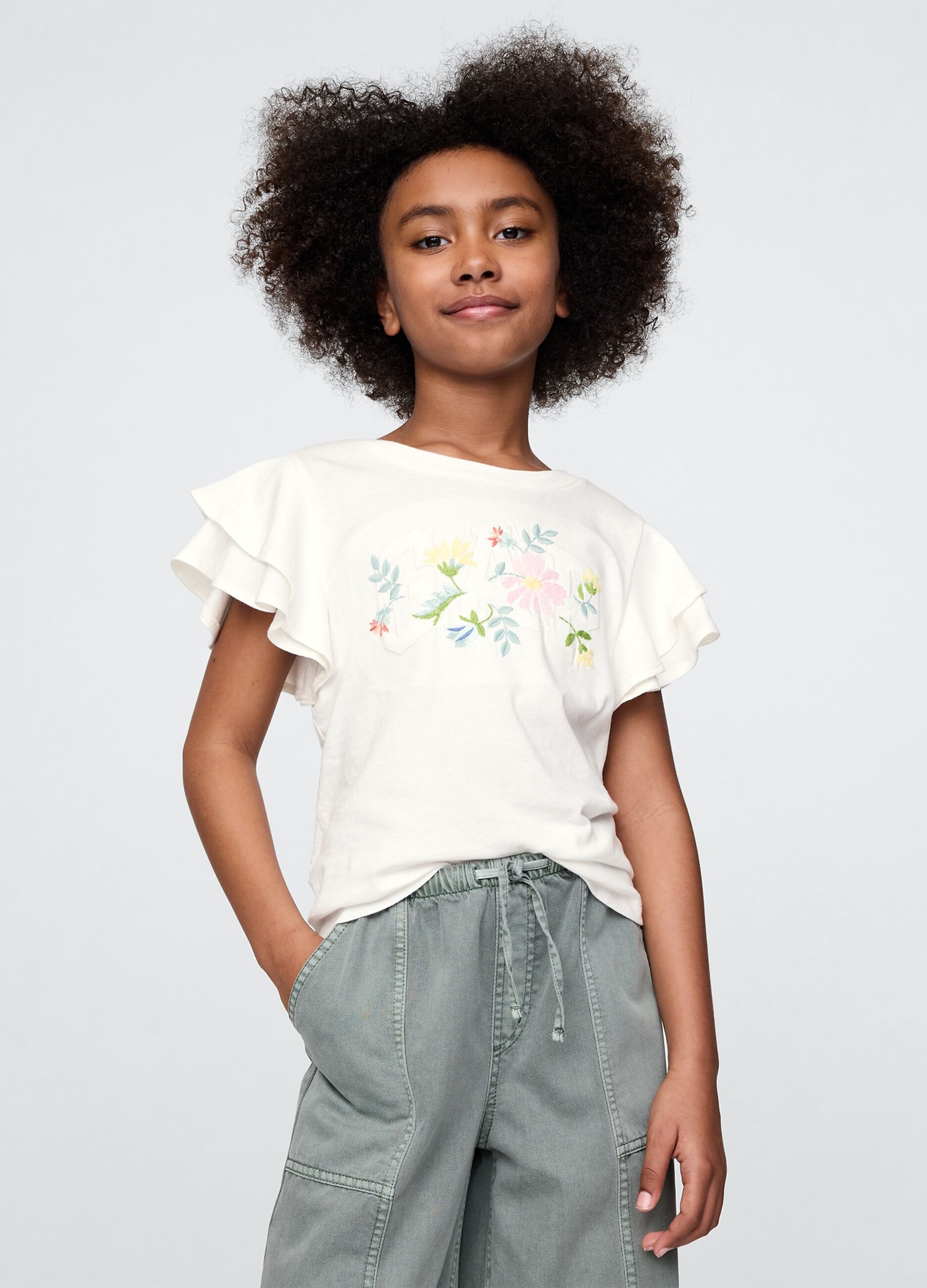 T-shirt a maniche corte bianca con volant e stampa floreale
