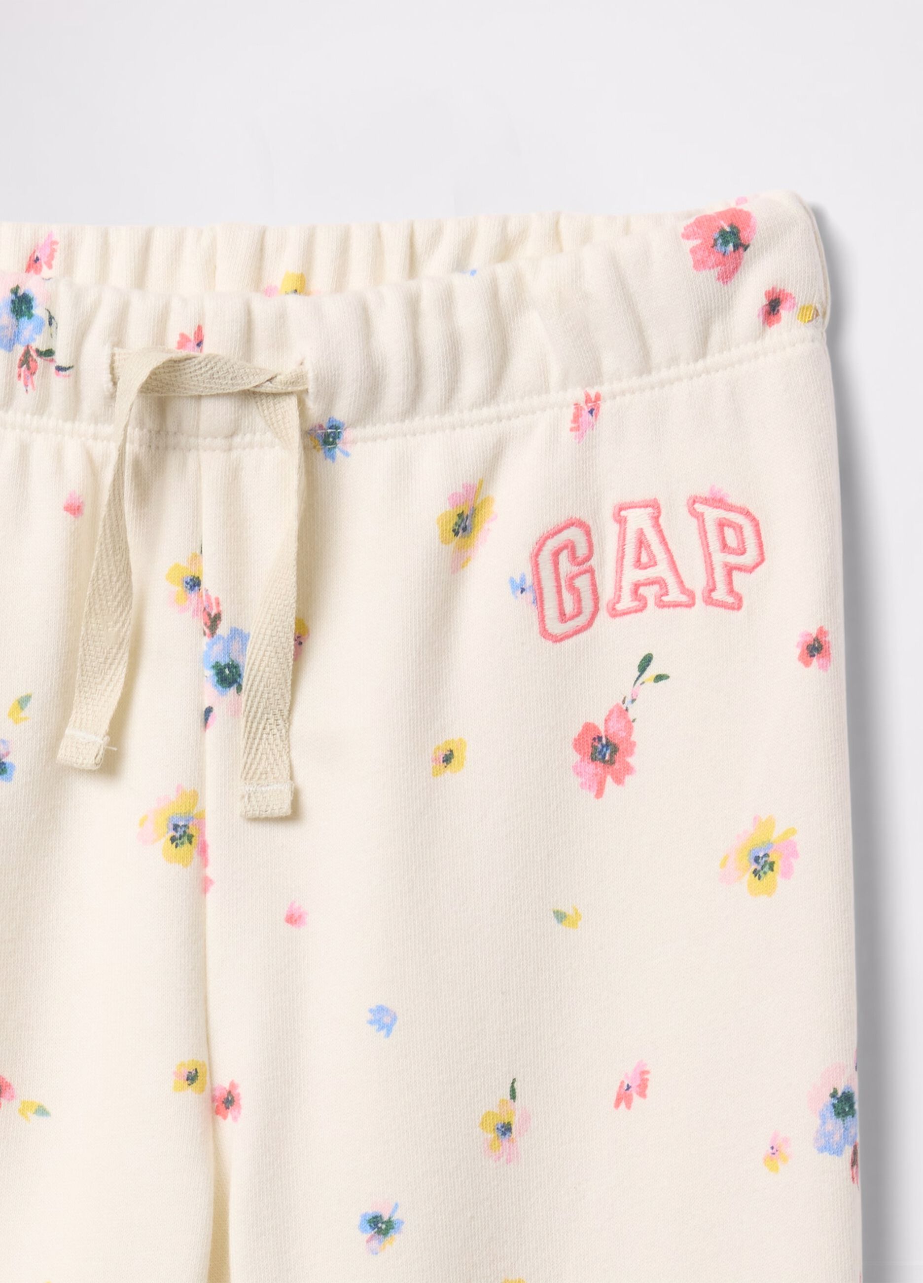Joggers bianchi con coulisse stampa fiori e ricamo logo_2