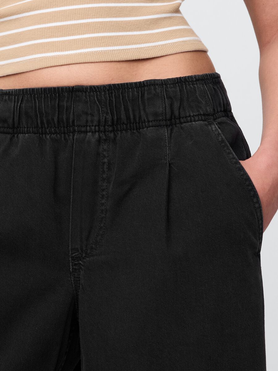 Pantaloni larghi neri con tasche Donna_4