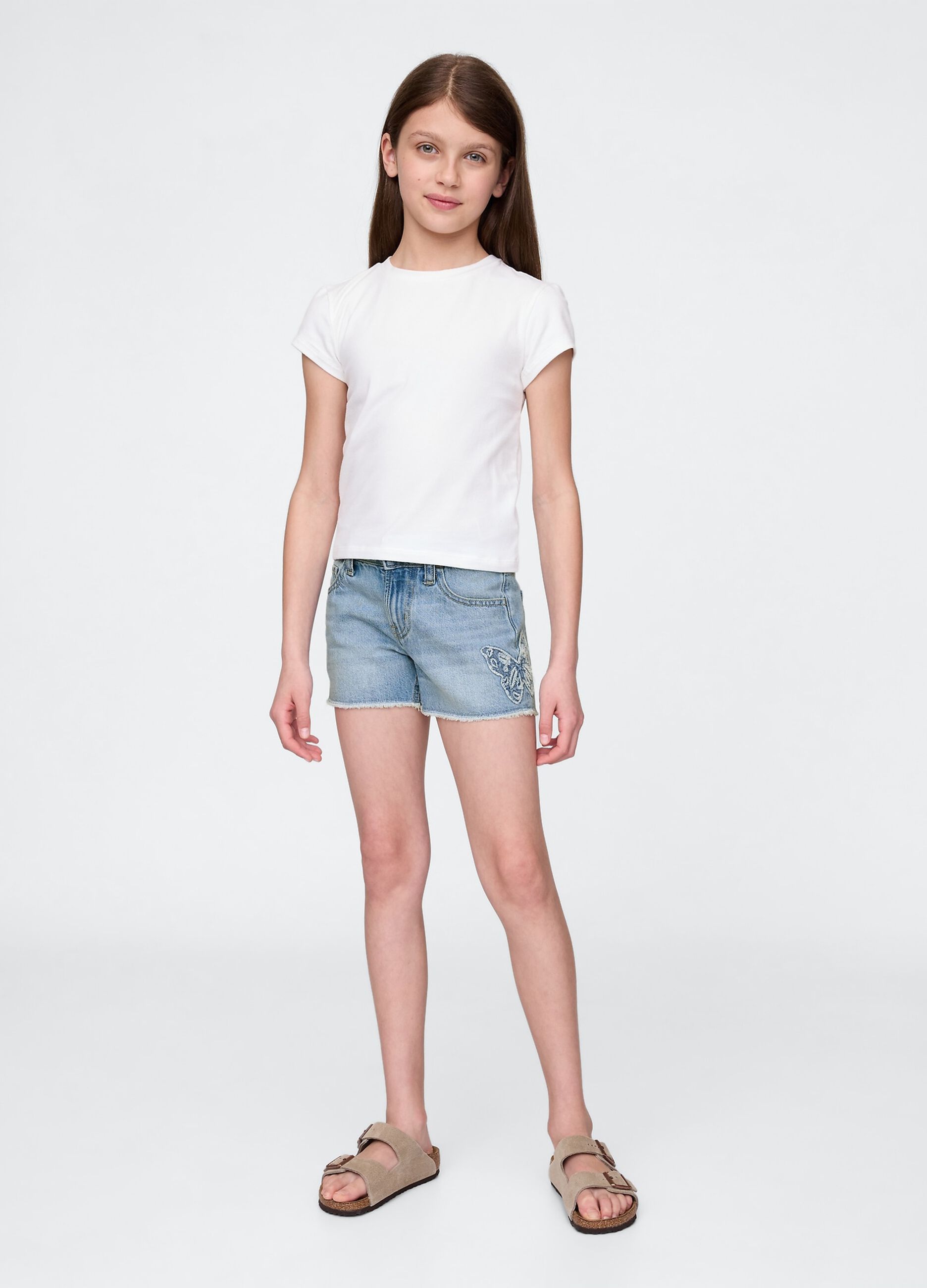 Shorts in denim chiaro con applicazione a farfalla