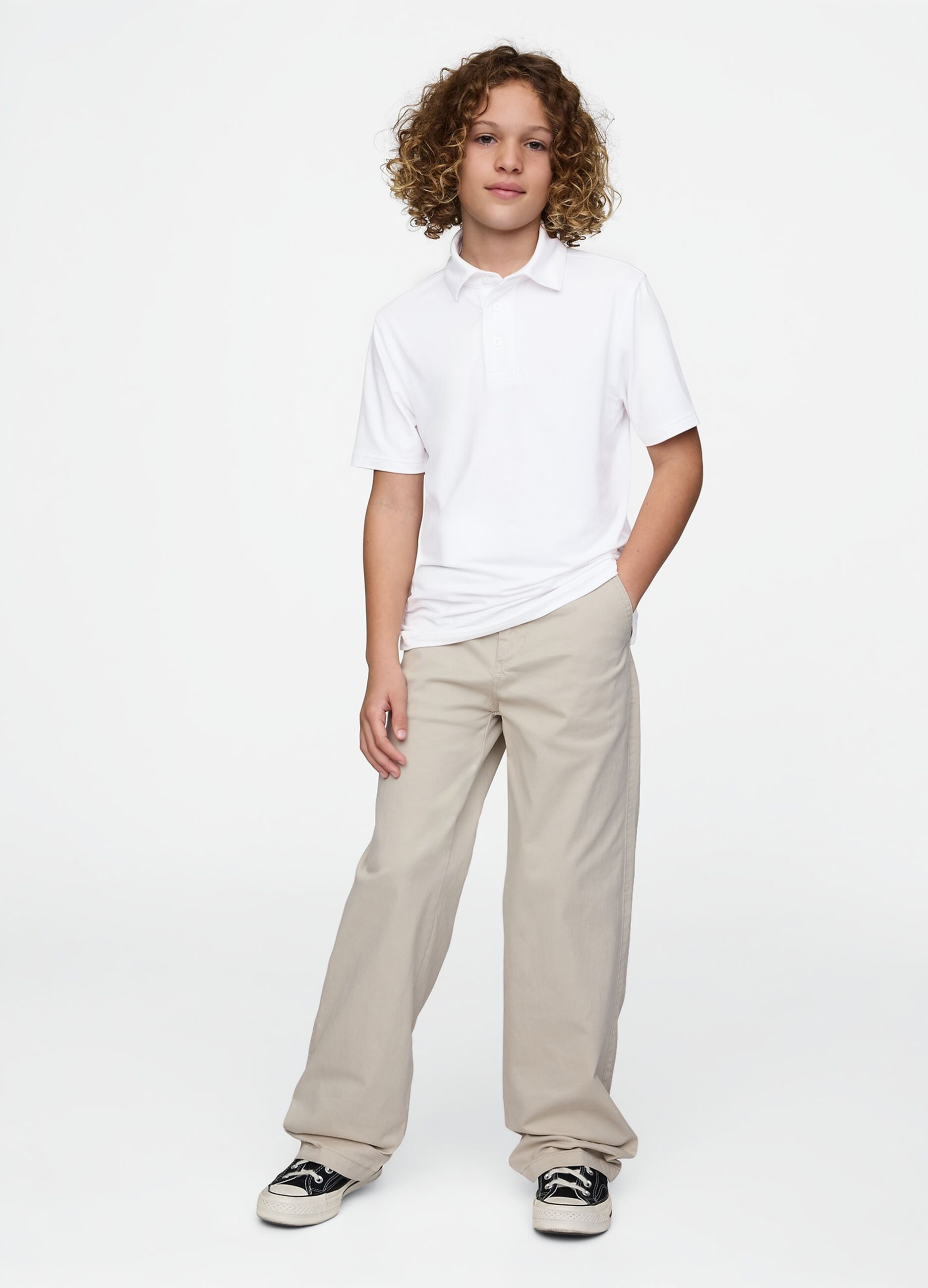 Polo bianca a maniche corte in tessuto elasticizzato GAP Kids_1
