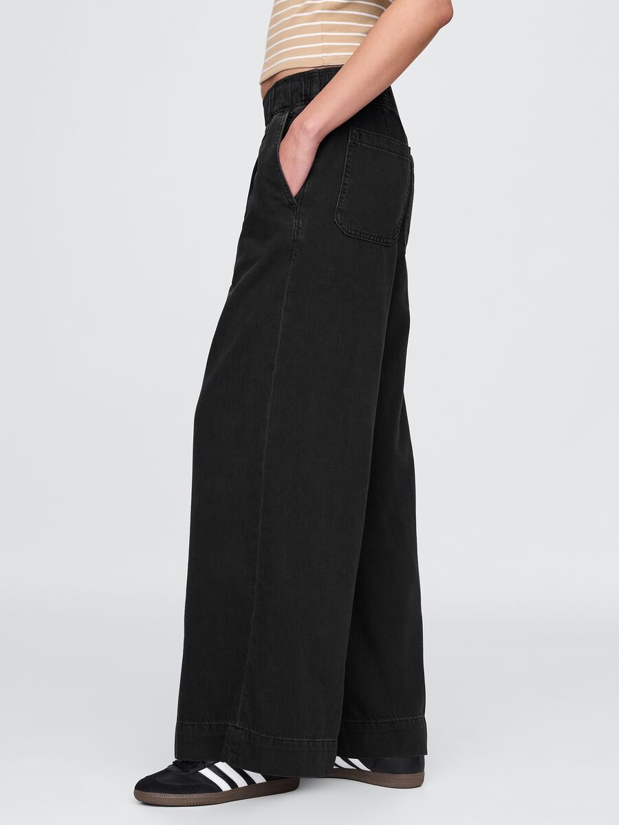 Pantaloni larghi neri con tasche Donna_3