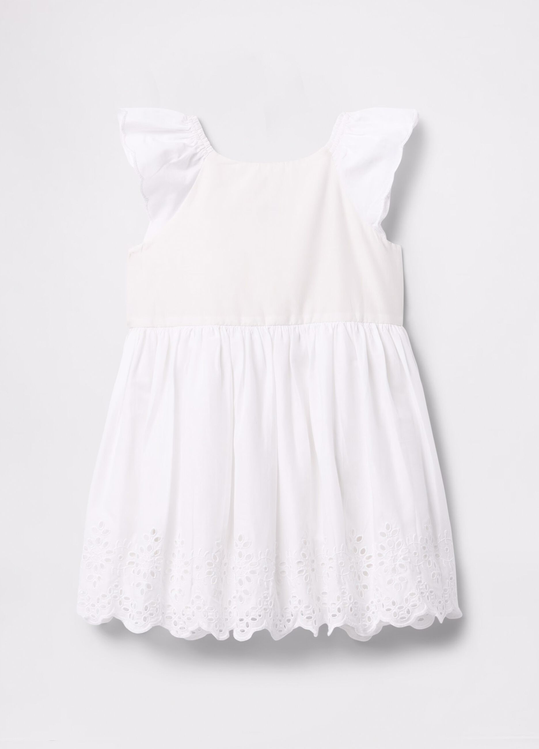 Abito bianco in cotone con fiori traforati_2