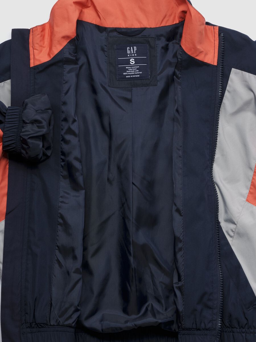 Light blue jacket with orange and grey accents Boy_1