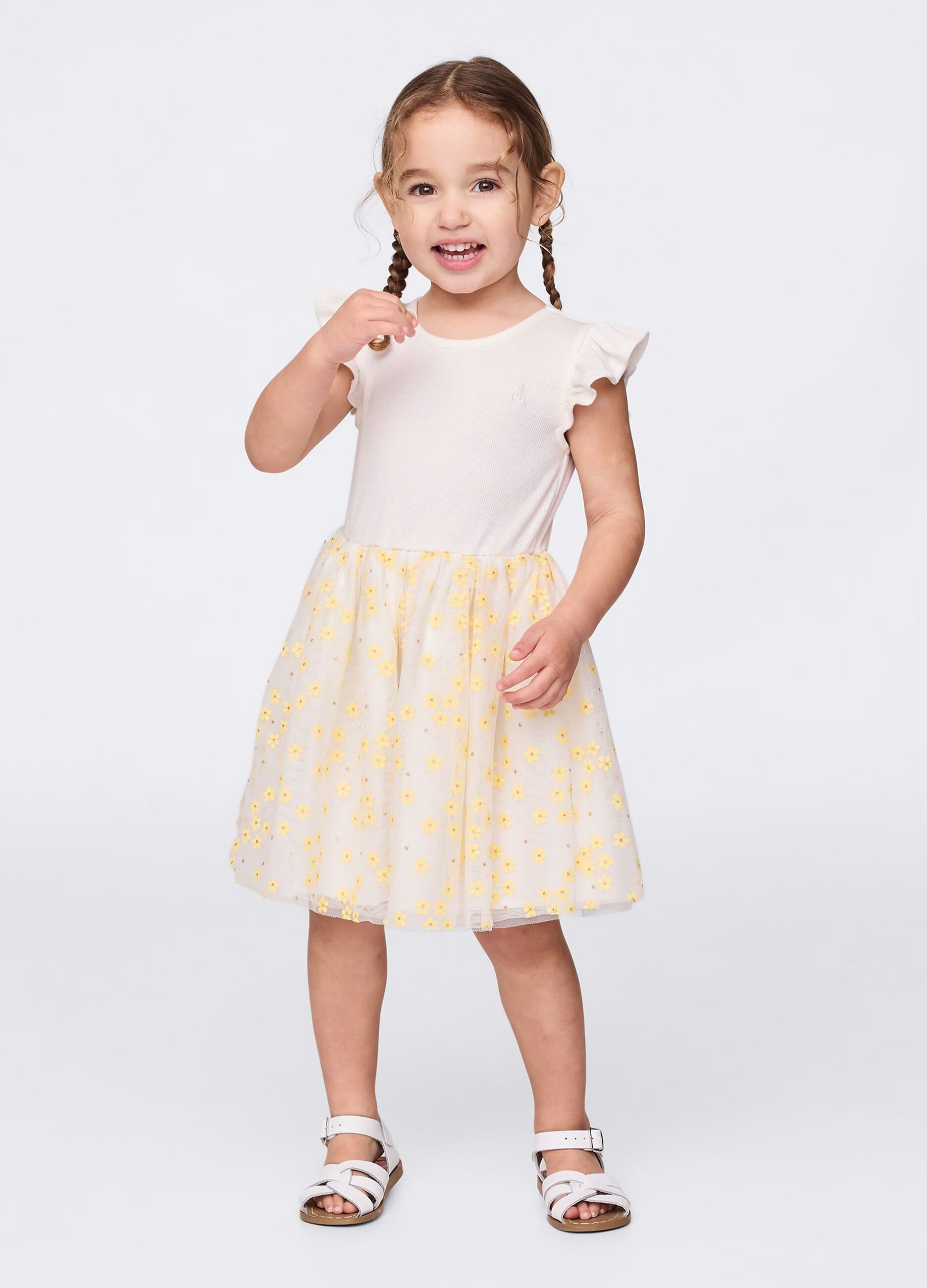 Abito bianco con gonna in tulle floreale