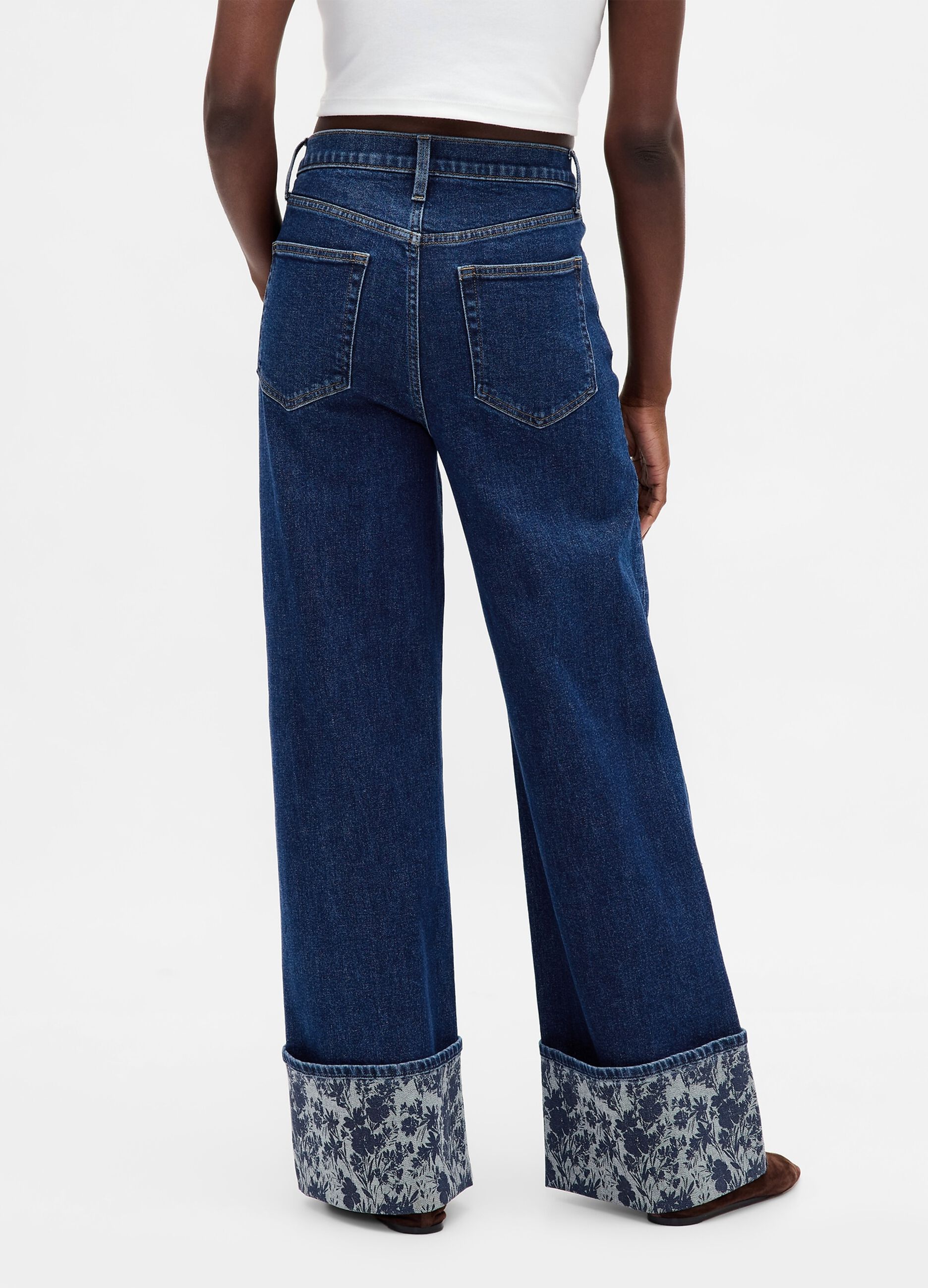 Wide denim trousers with floral turn-up