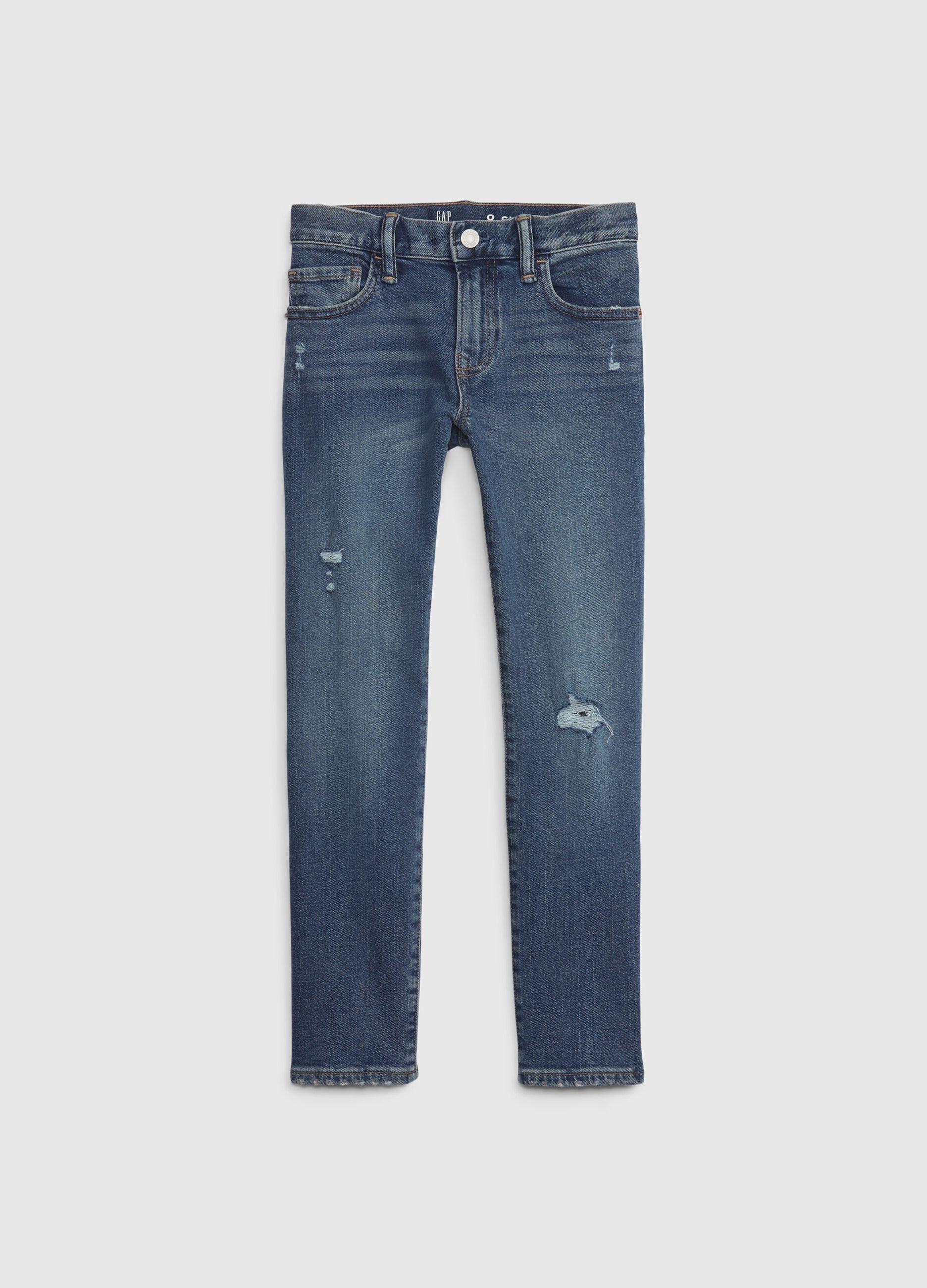 Jeans slim fit con scoloriture e abrasioni