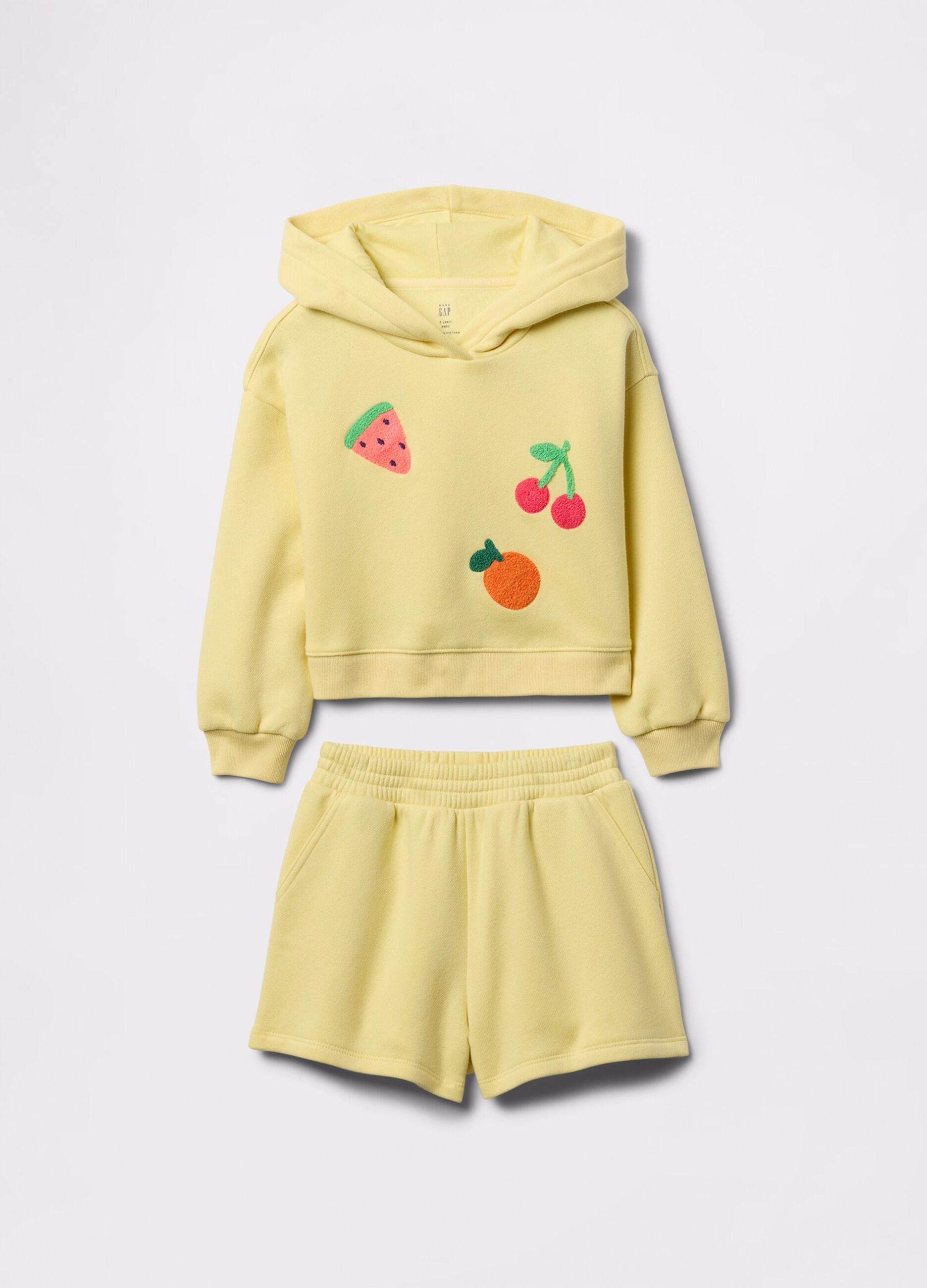 Jogging set giallo con patch frutta bouclé