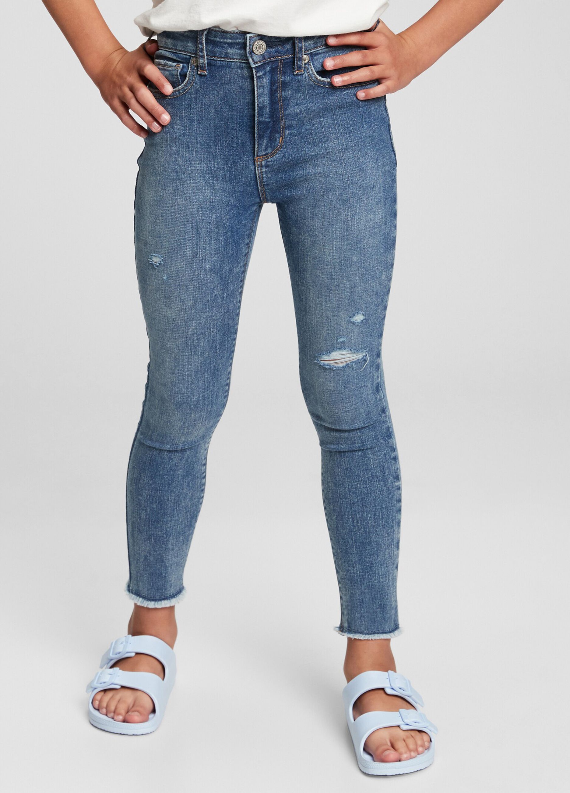 High-rise jeggings with acid wash and abrasions