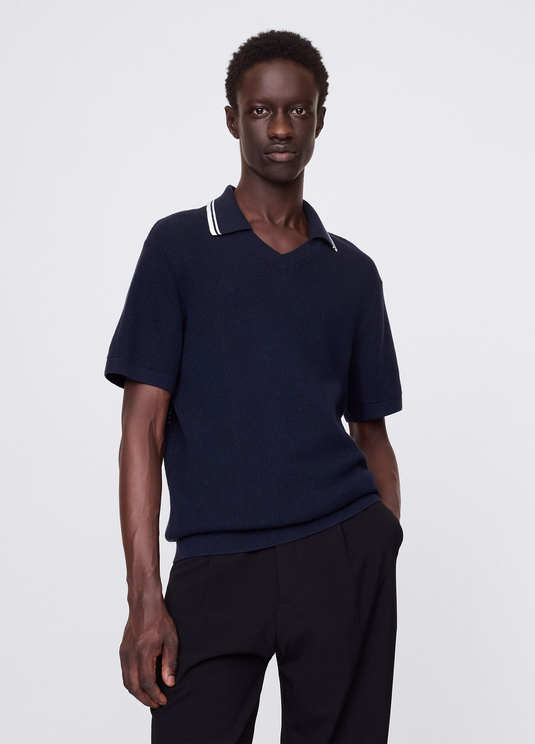 Polo traforata in cotone blu