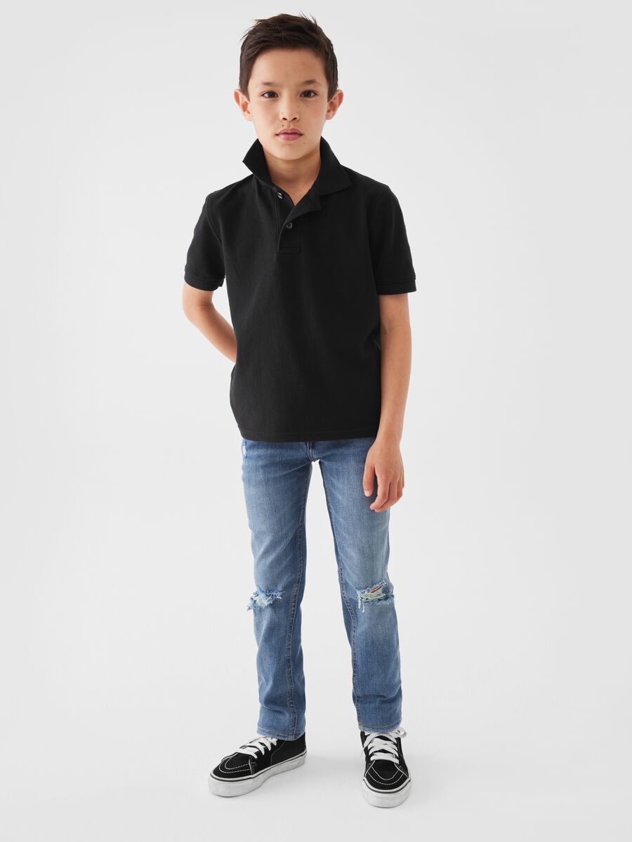 Jeans skinny fit con abrasioni Bambino_0